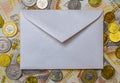 white envelope, blank note on money background, for finance and inflation Royalty Free Stock Photo