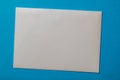 white envelope blank note pinned to a blue notice board Royalty Free Stock Photo