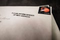 White envelope with change of address stamp