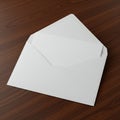 White envelope with an inserted letter placed on a dark wood surface. The envelope is Royalty Free Stock Photo
