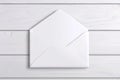 White Envelope Mockup Isolated Open Blank white envelope mockup open and isolated on white wood Clean simple communication Royalty Free Stock Photo