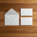 White envelope with an open flap is positioned on a wooden surface with two blank Royalty Free Stock Photo