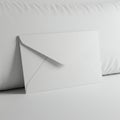 A white envelope is placed on a white surface. The envelope is standard-sized with a Royalty Free Stock Photo