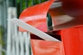 White envelope in red mail box on home fence Royalty Free Stock Photo