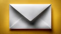 A white envelope rests on a vibrant yellow surface Royalty Free Stock Photo