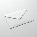 White envelope on a smooth, light-gray surface. The envelope is neatly sealed, showing Royalty Free Stock Photo