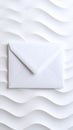 White Envelope on Textured Wave Pattern Background Minimalist Design Royalty Free Stock Photo