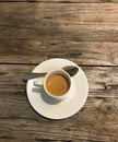 White espresso coffe cup on wooden table top down view Royalty Free Stock Photo