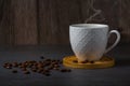 White espresso cup and coffee beans dark table background with copy space. Arabica grains, Coffee shop Royalty Free Stock Photo