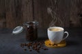 White espresso cup and coffee beans dark table background with copy space. Arabica grains, Coffee shop Royalty Free Stock Photo