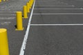 White even parking lines at car parking, separated by yellow boarder signs