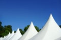 White event top tents and blue sky