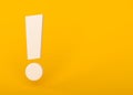 White exclamation mark on yellow background Royalty Free Stock Photo