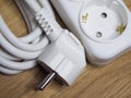 White extension cable with socket and plug, close-up Royalty Free Stock Photo