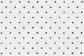 White fabric with black dots as background. Royalty Free Stock Photo