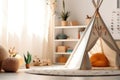 White fabric kids teepee and Native American decor in the interior of the children\'s room. AI generated