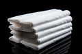 White fabric rolls textile material for sewing supply, on black background Royalty Free Stock Photo
