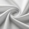 White fabric swirled in a spiral pattern, creating soft folds and a dynamic texture. The material Royalty Free Stock Photo