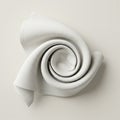 A white fabric swirled into a spiral shape against a neutral background. The texture Royalty Free Stock Photo