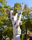 Birdhouses, birds and horns on a white tree