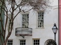 White facade, balcony tree and street lantern in Charleston, South Carolina, USA Royalty Free Stock Photo