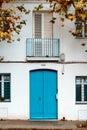 White facade with blue door, typical of the Spanish Mediterranean coast