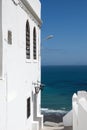 White facade wall and yellow and blue ocean in Tangier,Morocco Royalty Free Stock Photo