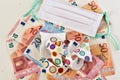 White facemask and a shattered cup on top of euro bills. Royalty Free Stock Photo