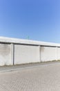 White Factory Brick Wall With Green Chimney