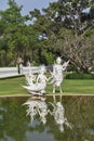 White fairy sculptures of winged creatures