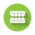 White False jaw icon isolated with long shadow. Dental jaw or dentures, false teeth with incisors. Green circle button