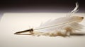 A white feather quill pen on a brown background. The pen is white and fluffy with a metallic nib. The nib is pointing to Royalty Free Stock Photo