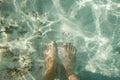 White feet relaxing his toes on the white sand of a beach Royalty Free Stock Photo