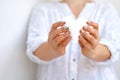 White felted heart in femaile hands with rainbow manicure. Love, valentine, lgbt, pride concept Royalty Free Stock Photo