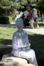 White human sculpture wearing turbans in the park
