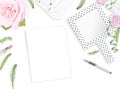 White feminine background. Flat lay. Notebook, pen, pink roses, mirror, leaves, gift, bag. Place for text. Cheerful mind every day