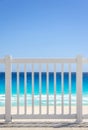 White fence and blue ocean on a tropical beach