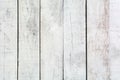 The texture of a worn white wooden wall. White boardwalk fence