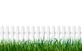 White fence and fresh green grass seamless background. endless wooden fence and green lawn isolated on white backdrop Royalty Free Stock Photo