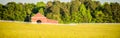 White fence leading up to a big red barn Royalty Free Stock Photo