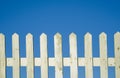 White fence with blue sky. Royalty Free Stock Photo