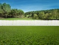 White fences on green grass Royalty Free Stock Photo