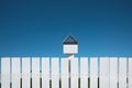 White fences with mailbox and blue sky, Clipping path Royalty Free Stock Photo