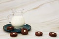 White fermented milk drink ayran in a transparent glass mug and chocolate cookies on a marble background Royalty Free Stock Photo