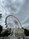 White ferris wheel against the background of a building in Elizabeth Square. Budapest, Hungary