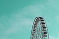 White Ferris wheel on aquamarine sky Royalty Free Stock Photo