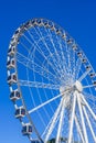 White ferris wheel over blue sky