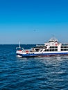 White ferry boat sailing on deep blue sea on a sunny day Royalty Free Stock Photo
