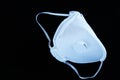 White ffp3 face mask with a valve on a black background Royalty Free Stock Photo