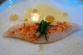 White fillet of most delicious fish John Dory, St Pierre or Peter\'s fish served with shell fish sauce in luxe restaurant in